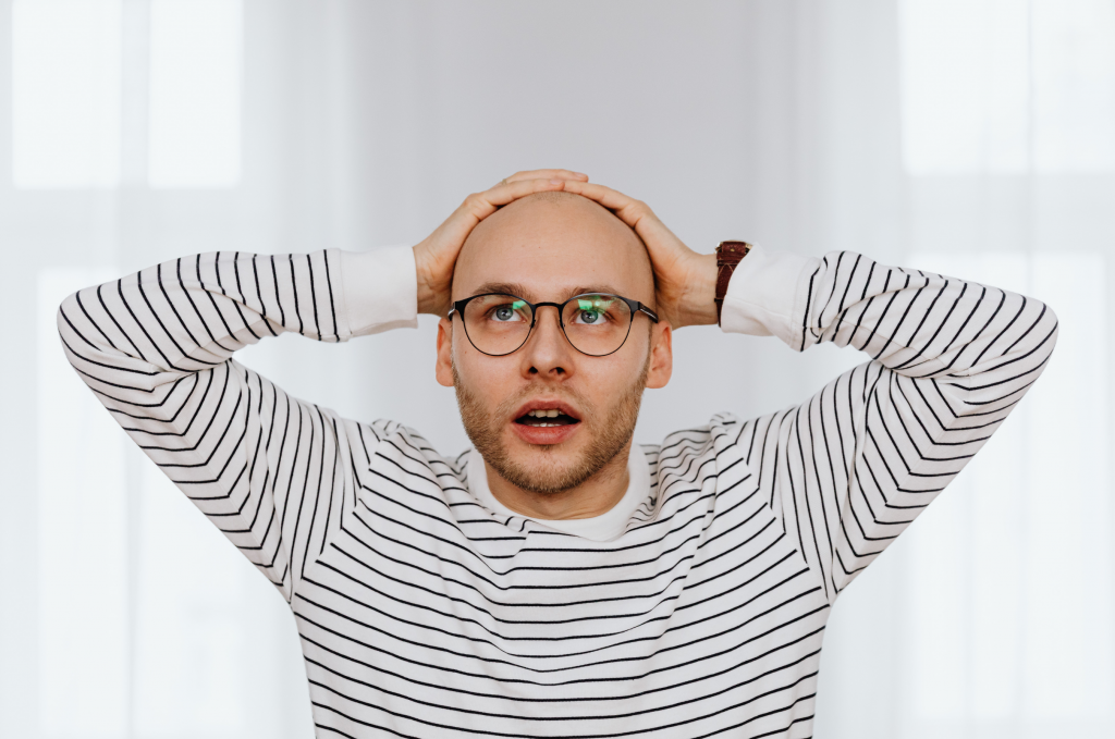 Pure O OCD concept showing a person deep in thought with a tense expression, symbolizing mental compulsions, intrusive thoughts, rumination, and the invisible struggle of OCD without physical rituals