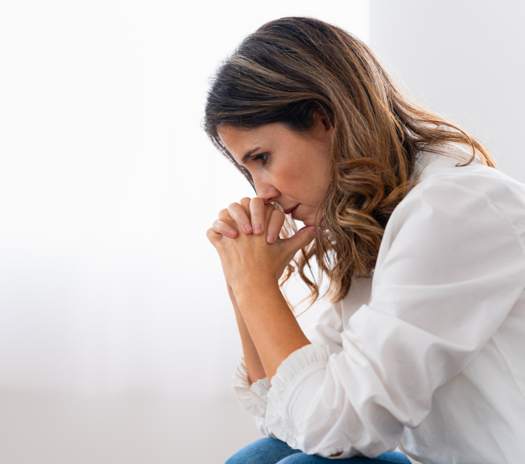 Person with OCD learning to stop rumination by disengaging from intrusive thoughts, illustrating a simple and powerful technique to break the rumination cycle and reduce anxiety